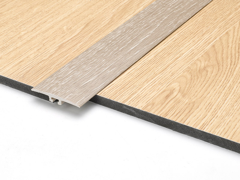 Tira de umbral de puerta con efecto de madera SPC de 42 * 6,6 mm